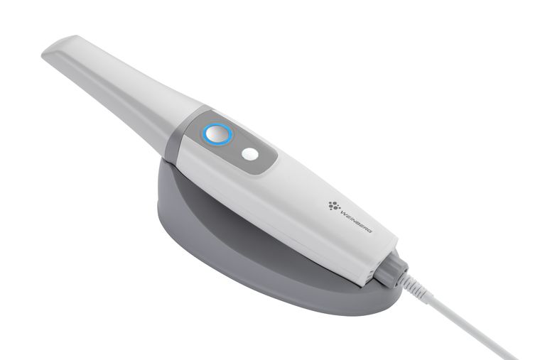 Handheld 3D intraoral scanner in its cradle